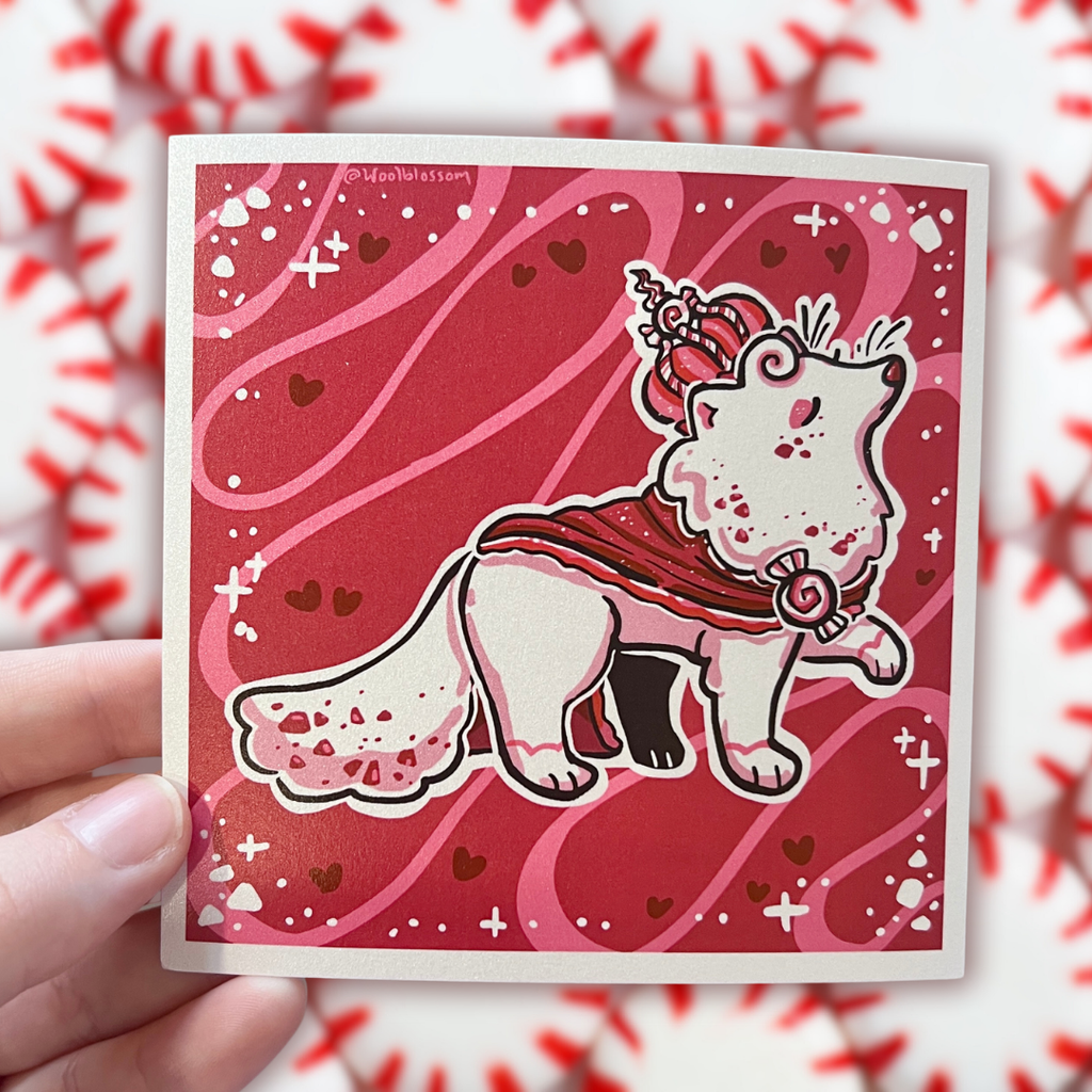 A print of a white fox with red specks, red robe, and red peppermint crown