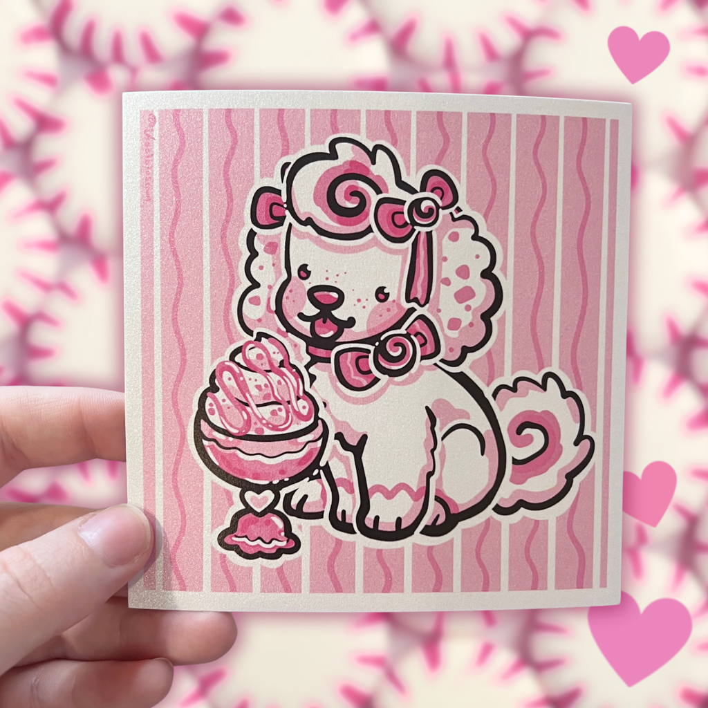 A print of a white puppy with pink accents and bows eating ice cream