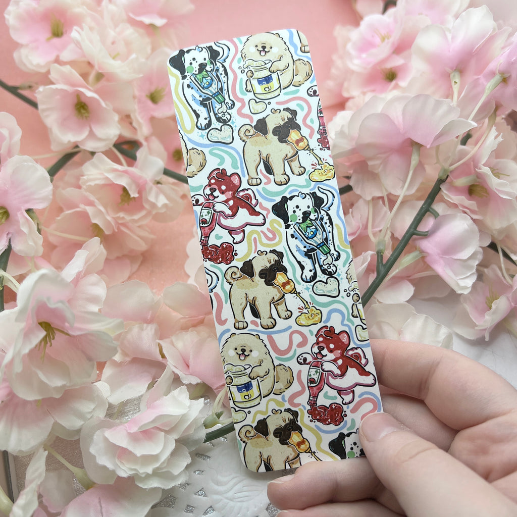 A bookmark featuring a pattern of condiment themed puppies