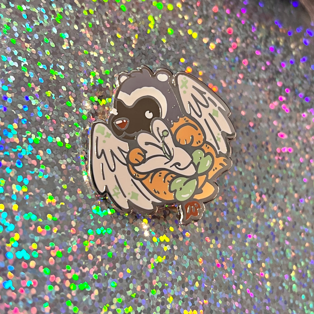 an enamel pin of a badger gryffin holding a honeysuckle on a glittery background