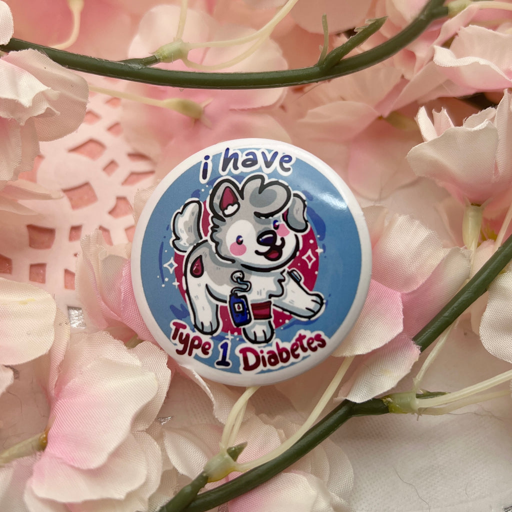 a button that says "I have type one diabetes" as well as a puppy. It also features a glucose monitor.