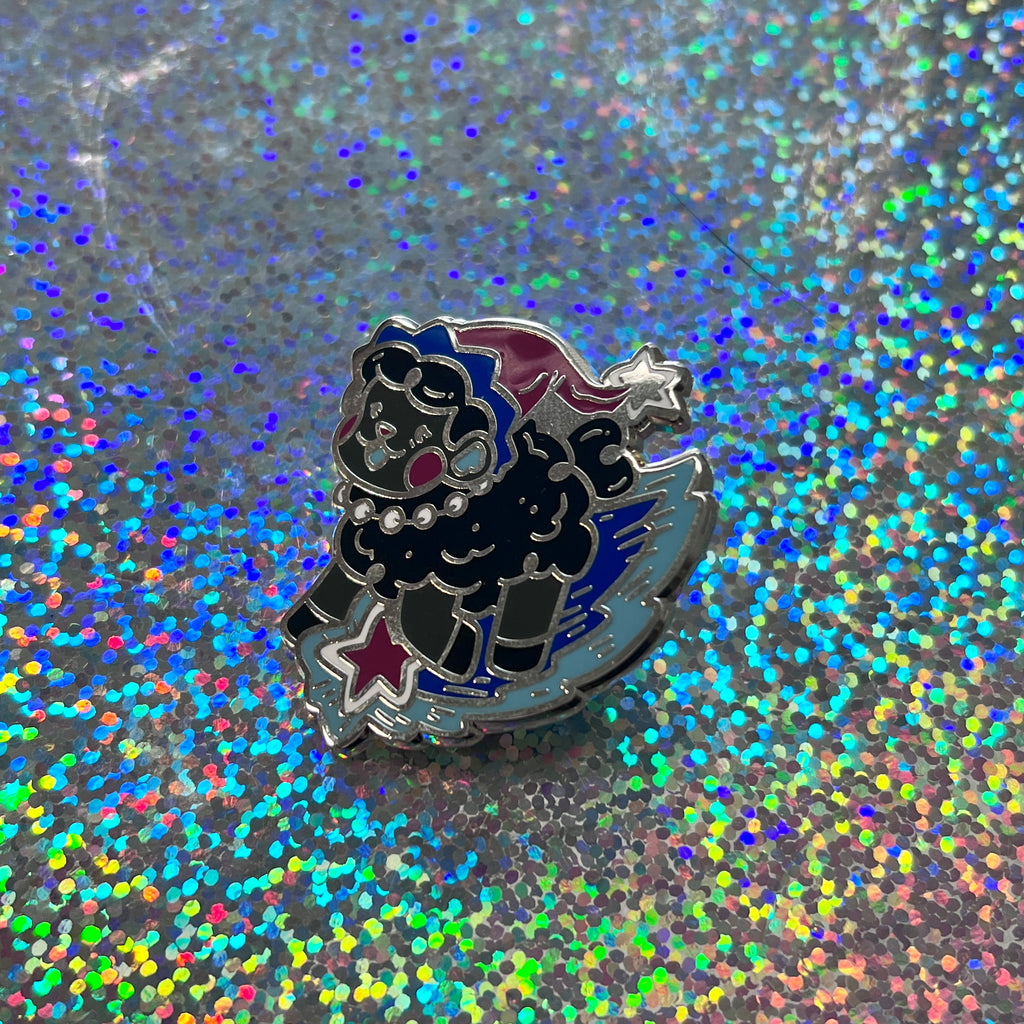 The witch sheep pin on a glittery background