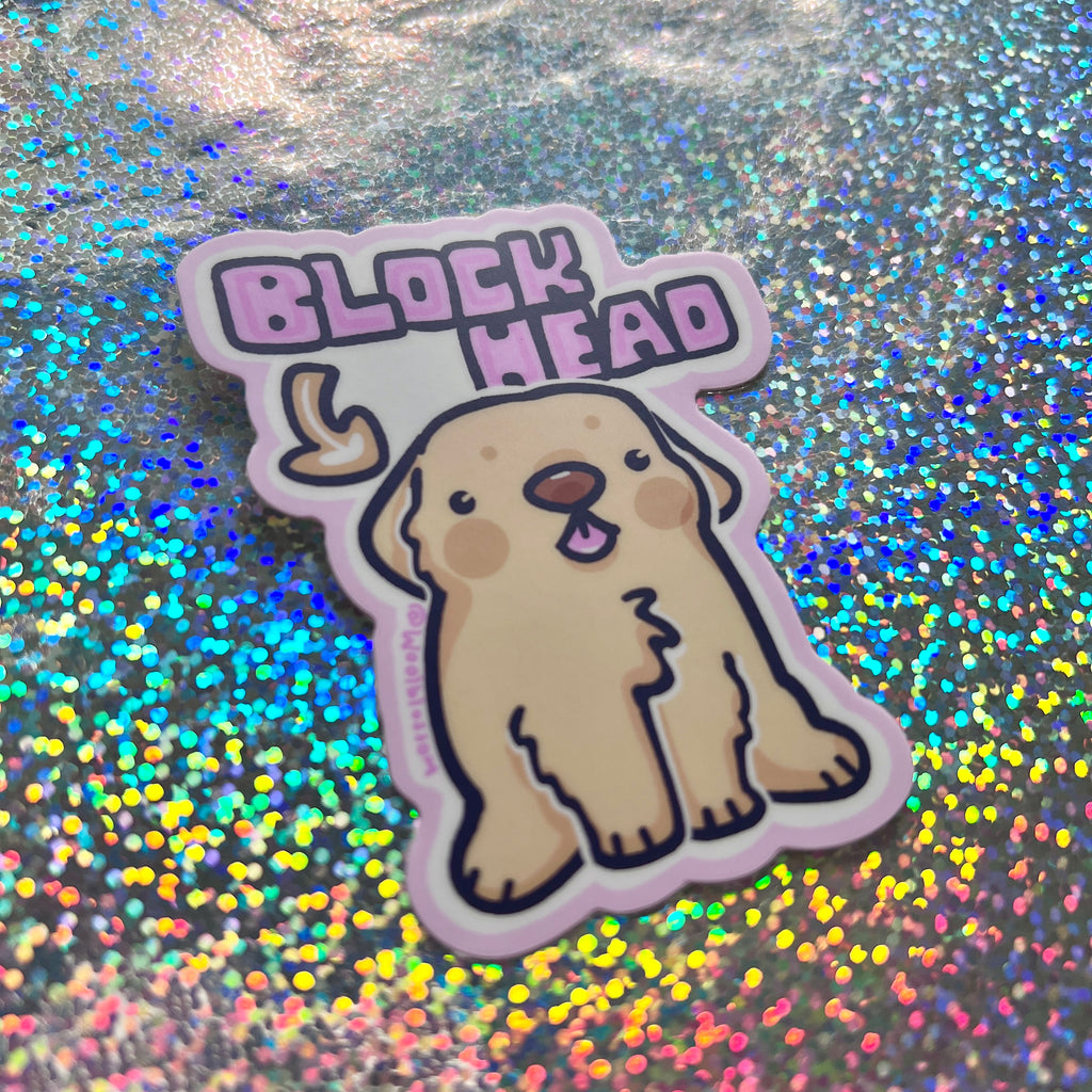 Sticker of a dog with 'Block Head' text on a glittery background