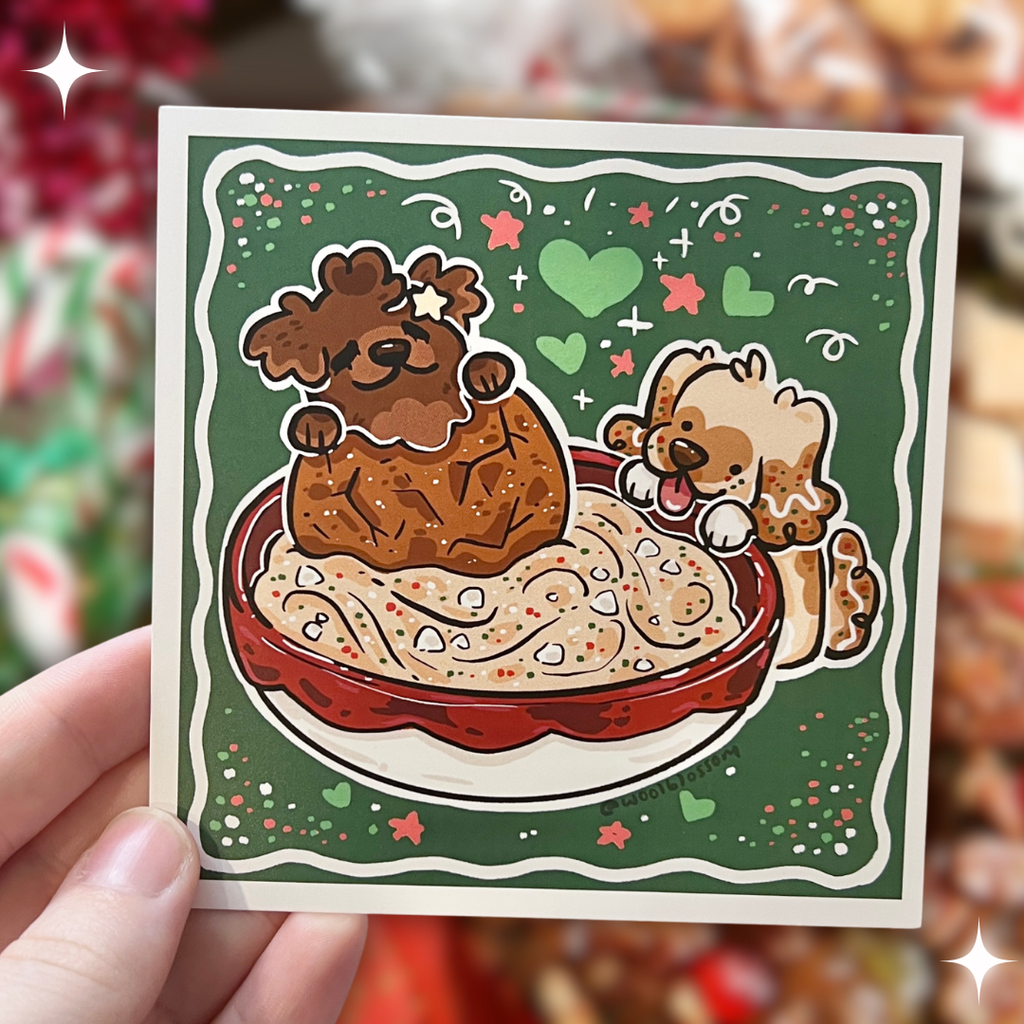 A print of Cinnamon the Gingersnap puppy and Caramel the Sugarcookie puppy digging into cheesecake dip with a gingersnap