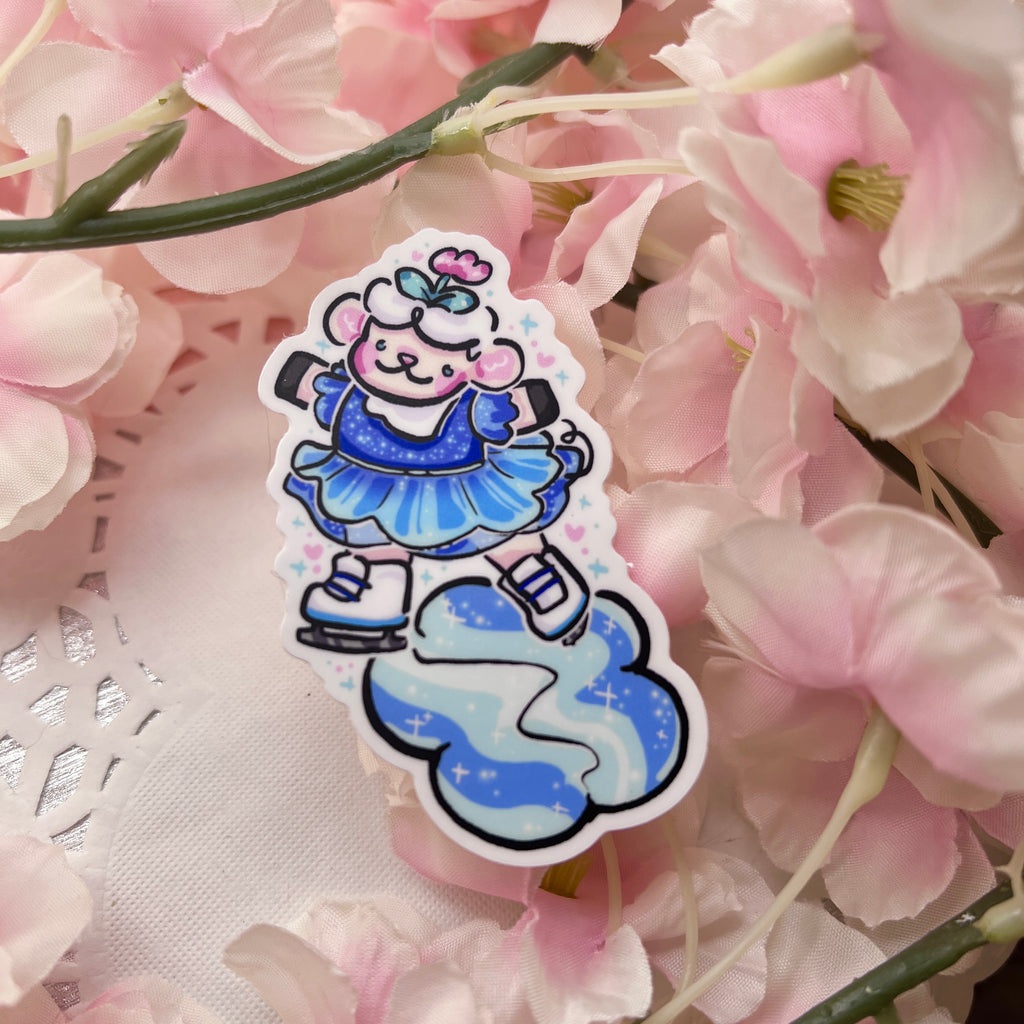 A sticker of Sprout the sheep on their hind legs skating on a flower patch of ice. They are in a blue glittery dress.