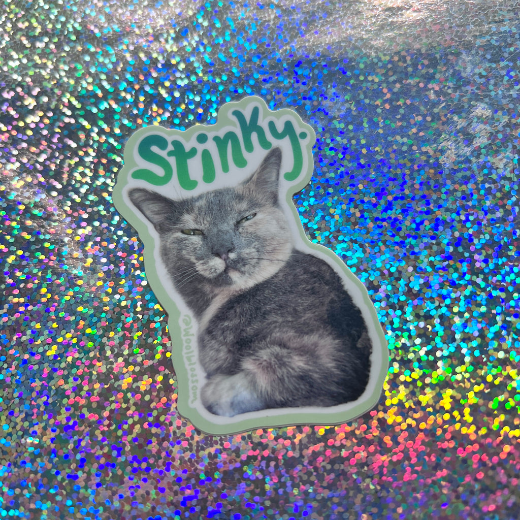 A sticker of chai my cat with text that says "stinky"