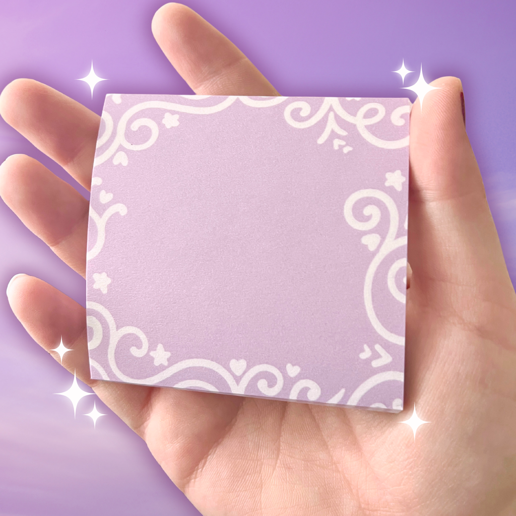 Hand holding a sticky note pad with white patterns against a matching purple background