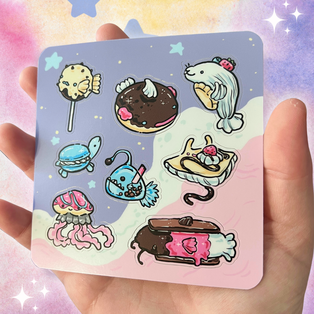 Cartoon stickers of food item sea creatures on a colorful sticker sheet held by a hand.