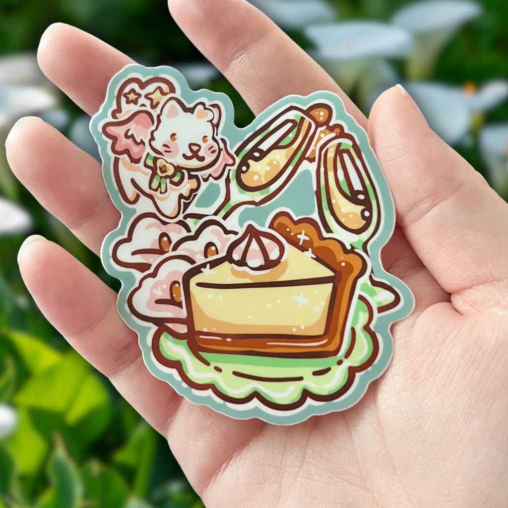 Sticker of a white angel cat flying around a celebration meal held in a hand with a blurred green background