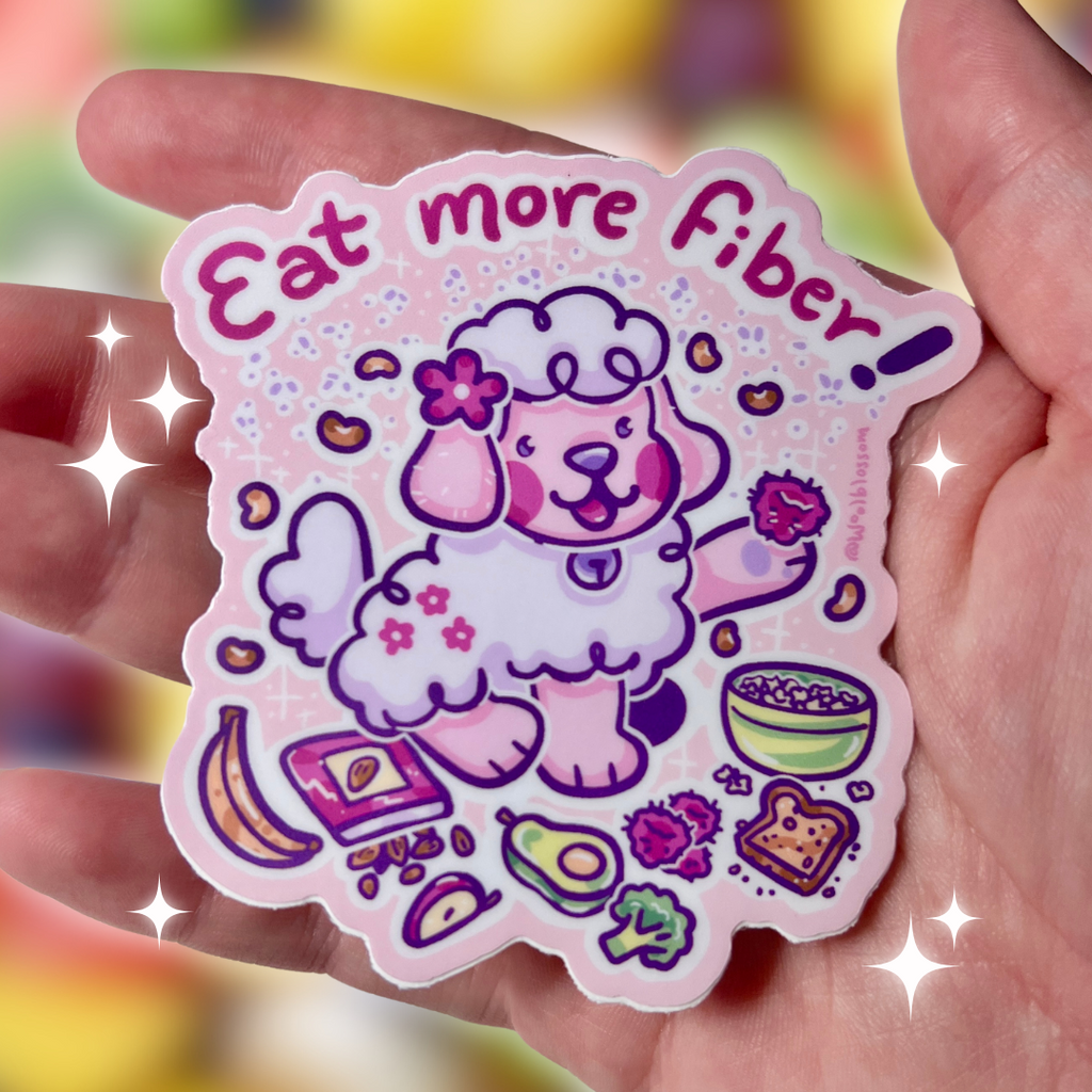 Sticker with a cartoon dog and text 'Eat more Fiber!' held in a hand against a blurred background.